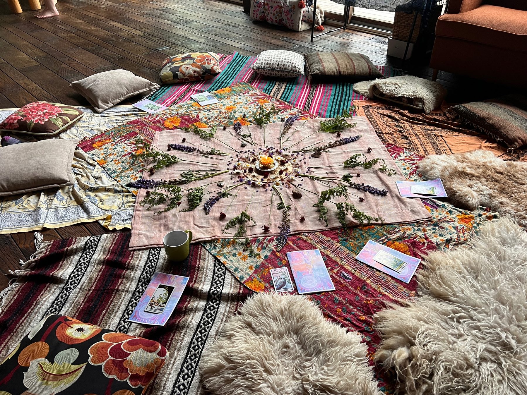 A ritual altar of herbs and dried flowers laid out during a retreat reset